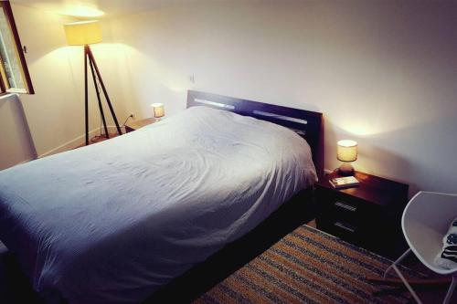 a bedroom with a bed and a desk with a chair at Magnifique bergerie corse du 17eme Siècle à proximité des plages in Eccica-Suarella