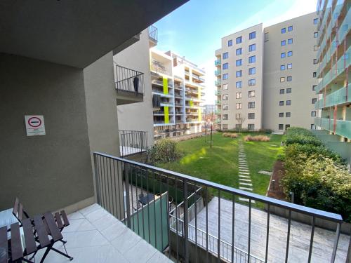 an apartment balcony with a view of a park at Corvin Center Suites in Budapest