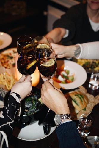 a group of people holding up wine glasses at a table at Clarion Hotel Arlanda Airport Terminal in Arlanda