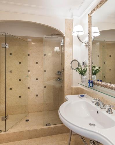 a bathroom with a sink and a shower at Grand Hotel Timeo, A Belmond Hotel, Taormina in Taormina