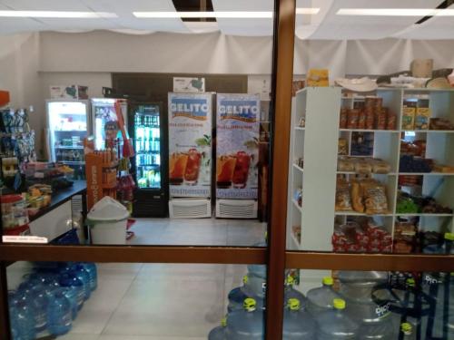 a store with a counter with food and drinks at Portoparadise - Beach Class Eco life Residence in Porto De Galinhas