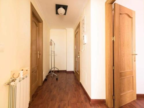 an empty hallway with two doors and a fan at Reade homes in Luton