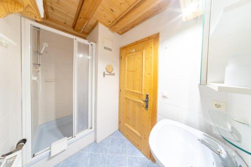 a bathroom with a shower and a sink at Haus Antonia in Wallgau