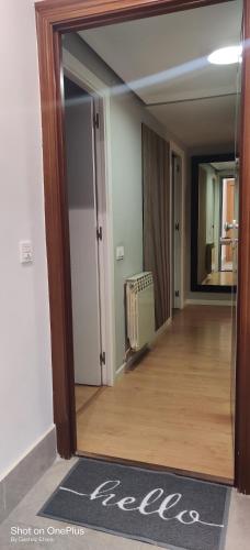 an empty hallway with a mirror in a room at Gasteiz Etxea l in Vitoria-Gasteiz