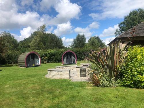 two gazebos in the grass in a yard at Belle Vista Glamping & Camping in York