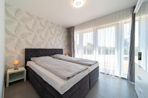 Postel nebo postele na pokoji v ubytování Appartement 2 - Dünenblick