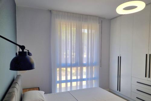 Postel nebo postele na pokoji v ubytování White Moon Apartments