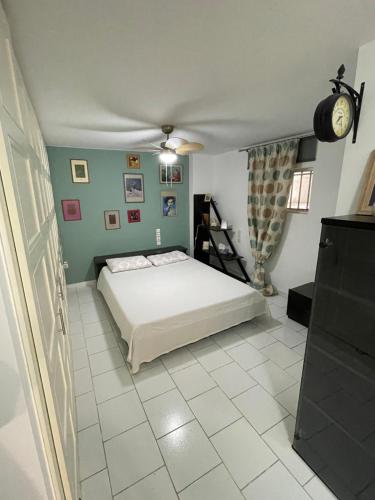 a bedroom with a bed and a tiled floor at Da Suzy in Patra