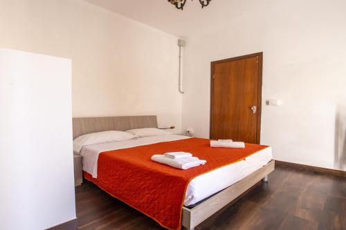 Ένα ή περισσότερα κρεβάτια σε δωμάτιο στο Casa D'alunzio-appartamento Rebiba