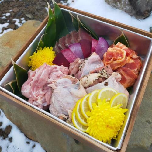 a tray of food with different types of seafood at villa福座 in Furusan