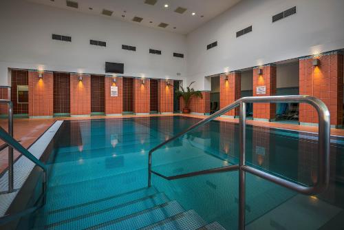 a large swimming pool in a building at GALANDA APARTMENTS in Turčianske Teplice