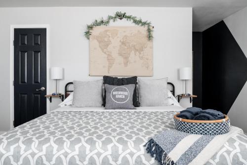 a bedroom with a bed with a map on the wall at Anderson Cottage at Wrenwood Ranch, King Bed, Walking Distance to the Winery in Johnson City