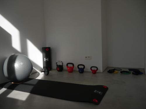 a room with a yoga mat and a group of shoes at Château du Pont d'Oye in Habay-la-Neuve