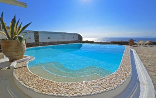 Luxurious waterfront villa Christina in the area of Melissaki with a swimming pool, sea and sunset view