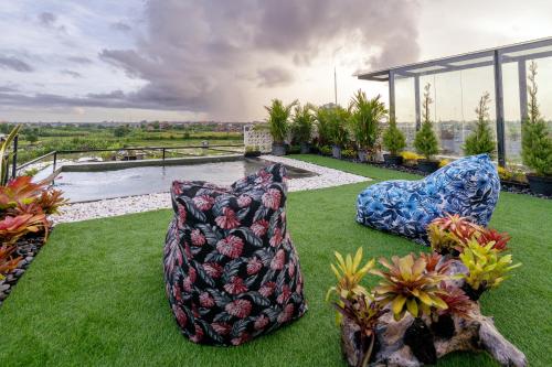 two pillows sitting on top of a field of grass at Casa Jenah Three Bedroom Villa in Kesiman