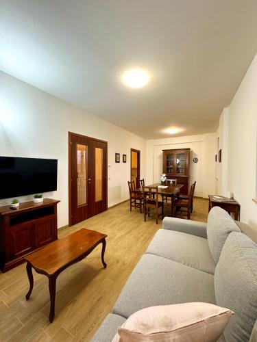a living room with a couch and a table at La Casa di Garibaldi - Vista per le Montagne in San Demetrio neʼ Vestini