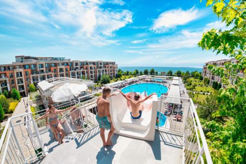 a view of the pool on the upper deck of a resort at Premier Fort Beach Hotel in Sveti Vlas