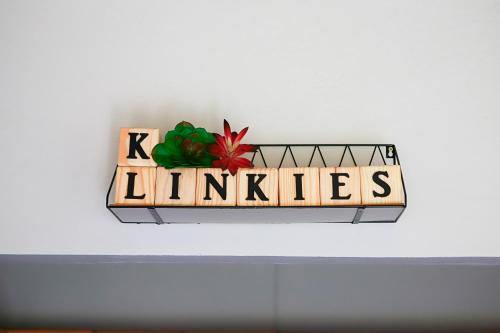 a sign that reads lillies on a wall at Klinkies in Potchefstroom