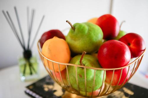 a basket of fruits and vegetables on a table at Klinkies in Potchefstroom
