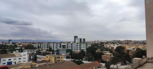 a view of a city with buildings in the background at Baba Residence in Oran
