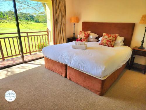 Villa G26 - Selborne Golf Estate tesisinde bir odada yatak veya yataklar