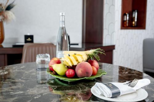 a plate of fruit and vegetables on a table at Idou Anfa Hôtel & Spa in Casablanca