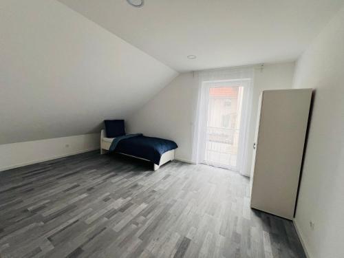 Postel nebo postele na pokoji v ubytování Apartment Weikersheim II