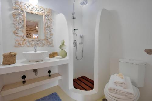a bathroom with a toilet and a sink and a shower at Villa Princess 6 private with Pool Panormos Beach in Panormos Mykonos