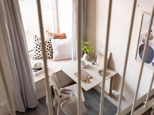 a small room with a table and a window at Waterfront Cabins in Gothenburg