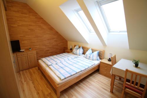 a bedroom with a bed and a skylight at Privatzimmer Fam. Führer in Ottenschlag