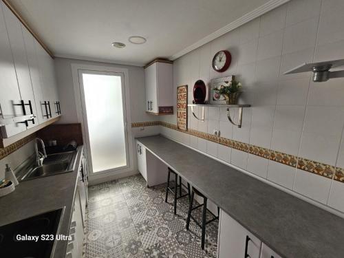 a kitchen with a sink and a counter with a sink at BENIMAR 2 BEACH VIEW in Cala de Finestrat