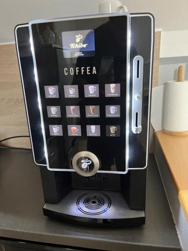 an iphone in a coffee maker on a desk at Privatzimmer Fam. Führer in Ottenschlag