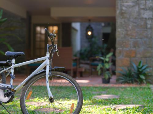 a bike parked in front of a house at Mystic Mayapott, Thekkady in Thekkady