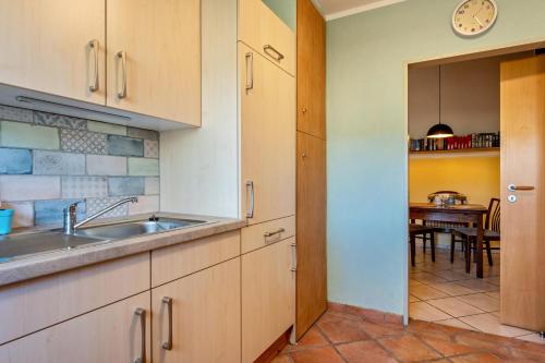 a kitchen with a sink and a table at Bücherträume in Windeby