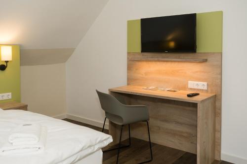 TV o dispositivi per l'intrattenimento presso Roca Restaurant und Hotel
