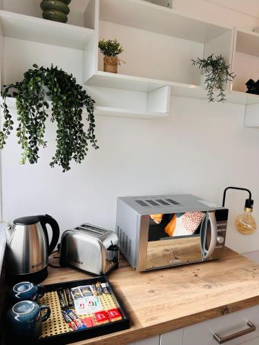 a kitchen counter with a toaster oven on a counter at Private Room in Modern Shared Apartment, Each with Kitchenette, Central Birmingham R2 in Birmingham