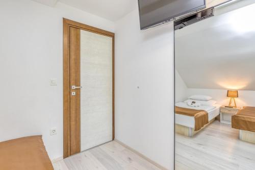 a room with a door leading to a bedroom at Villa Four Stars ART-PE in Trebnje