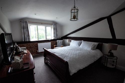 Кровать или кровати в номере High Barn