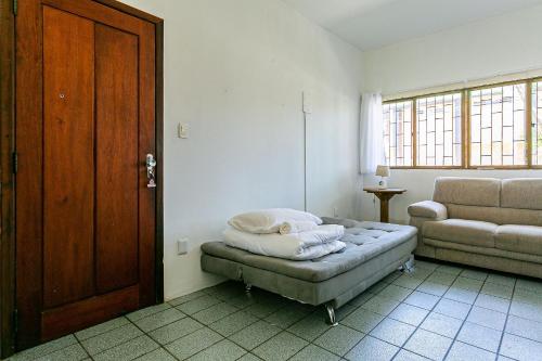 En eller flere senge i et værelse på Apto a 200 do mar no centrinho de Jurerê PSD101