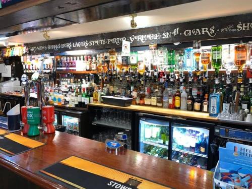 a bar with a lot of bottles of alcohol at Seaview Inn in Falmouth