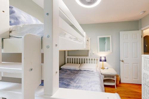 a bedroom with two bunk beds and a bed at Town of Rehoboth Beach - 50A Olive Ave in Rehoboth Beach