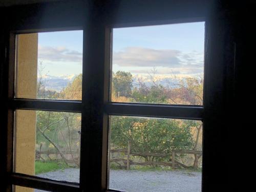 a view from a window looking out at the mountains at Casa Rural Trebol4Hojas in San Pedro