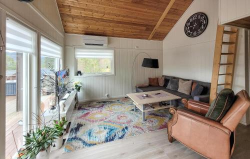 a living room with a couch and a table at Nice Home In Jelsa With Kitchen in Jelsa