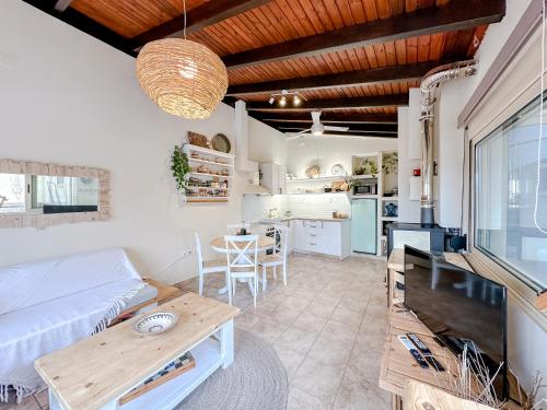 a living room with a couch and a table at Mountain Bliss Guesthouse 1 next to Sougia in Agrilés