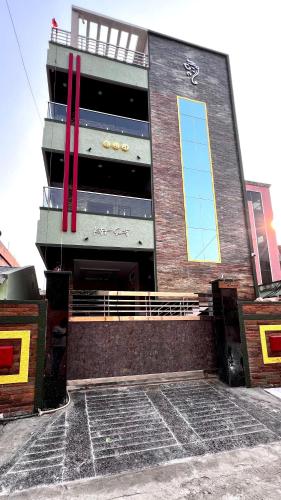 a large building with red crosses on the side of it at Katyayani Serenity - Your Premium Homestay in Bhadrāchalam