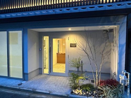 a front door of a house with a door open at Hotel Toin Kyoto in Kyoto
