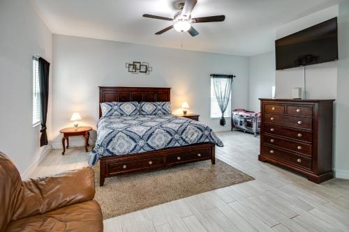 a bedroom with a bed and a dresser and a couch at Lanai, Private Pool Lehigh Acres Home in Lehigh Acres