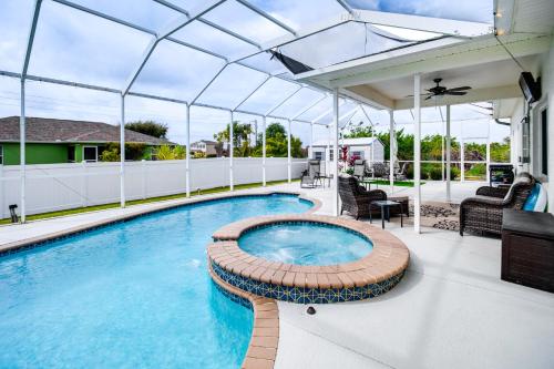 an indoor swimming pool with a pavilion on a house at Lanai, Private Pool Lehigh Acres Home in Lehigh Acres