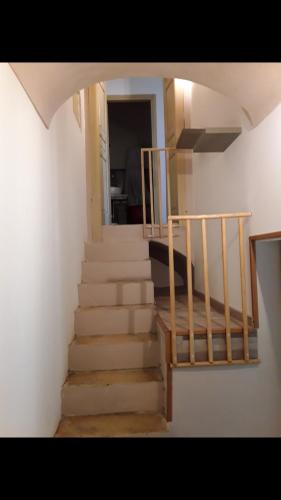 a staircase in a house with a stair case at Da zia Franca in Acate