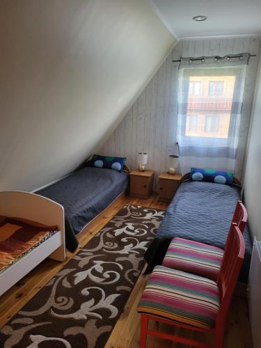 Voodi või voodid majutusasutuse Dom Zielony nad jeziorem Orzyskim toas